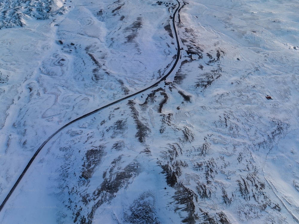 an aerial view of a snow covered mountain