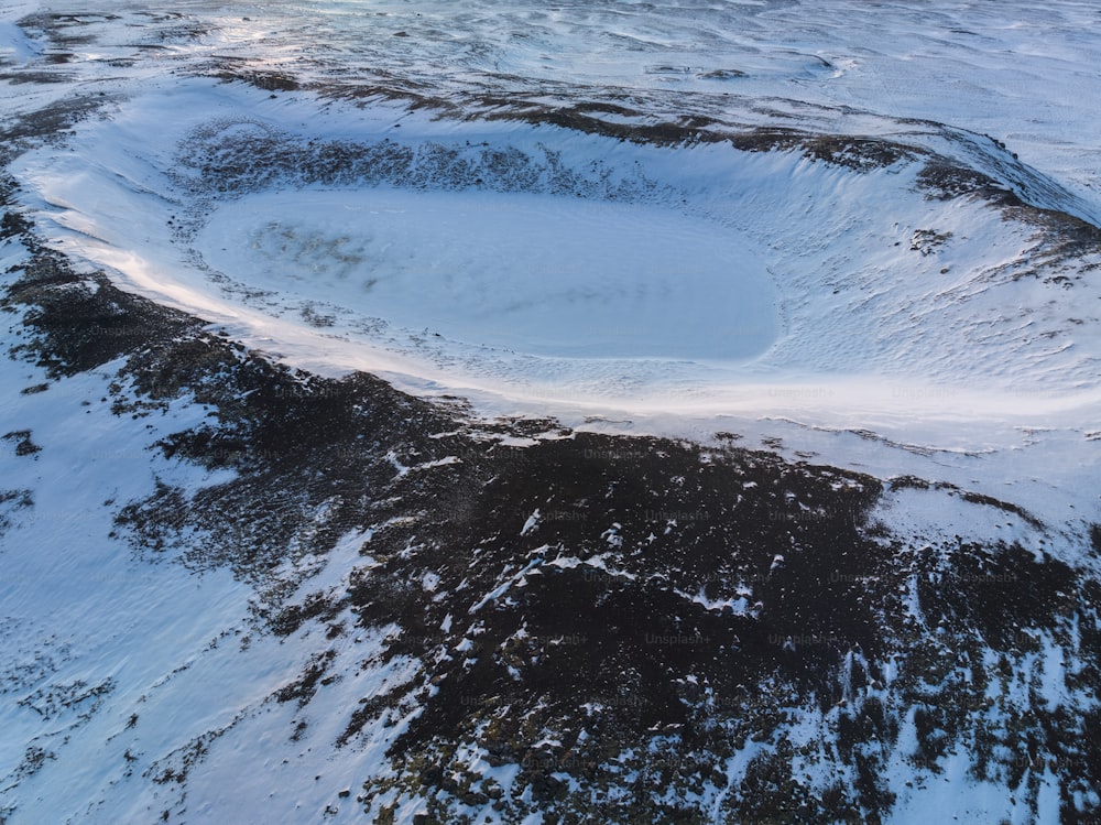 an aerial view of a snow covered mountain