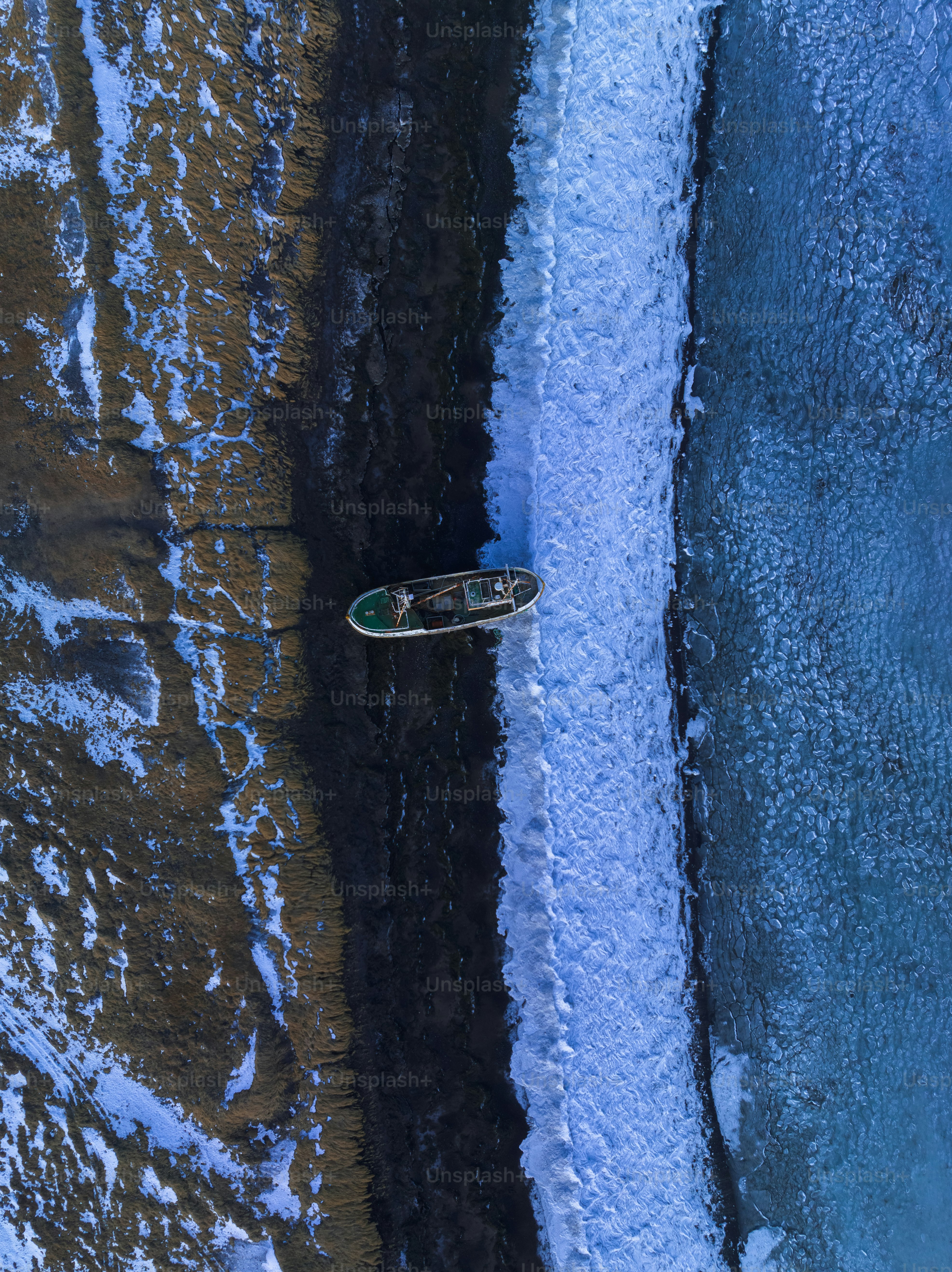 a man riding a snowboard on top of a body of water