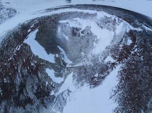 an aerial view of a snow covered mountain