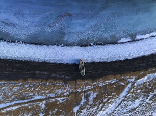 an aerial view of a surfboard in the water