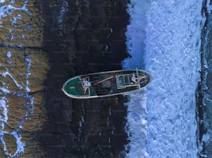 a small boat floating on top of a body of water