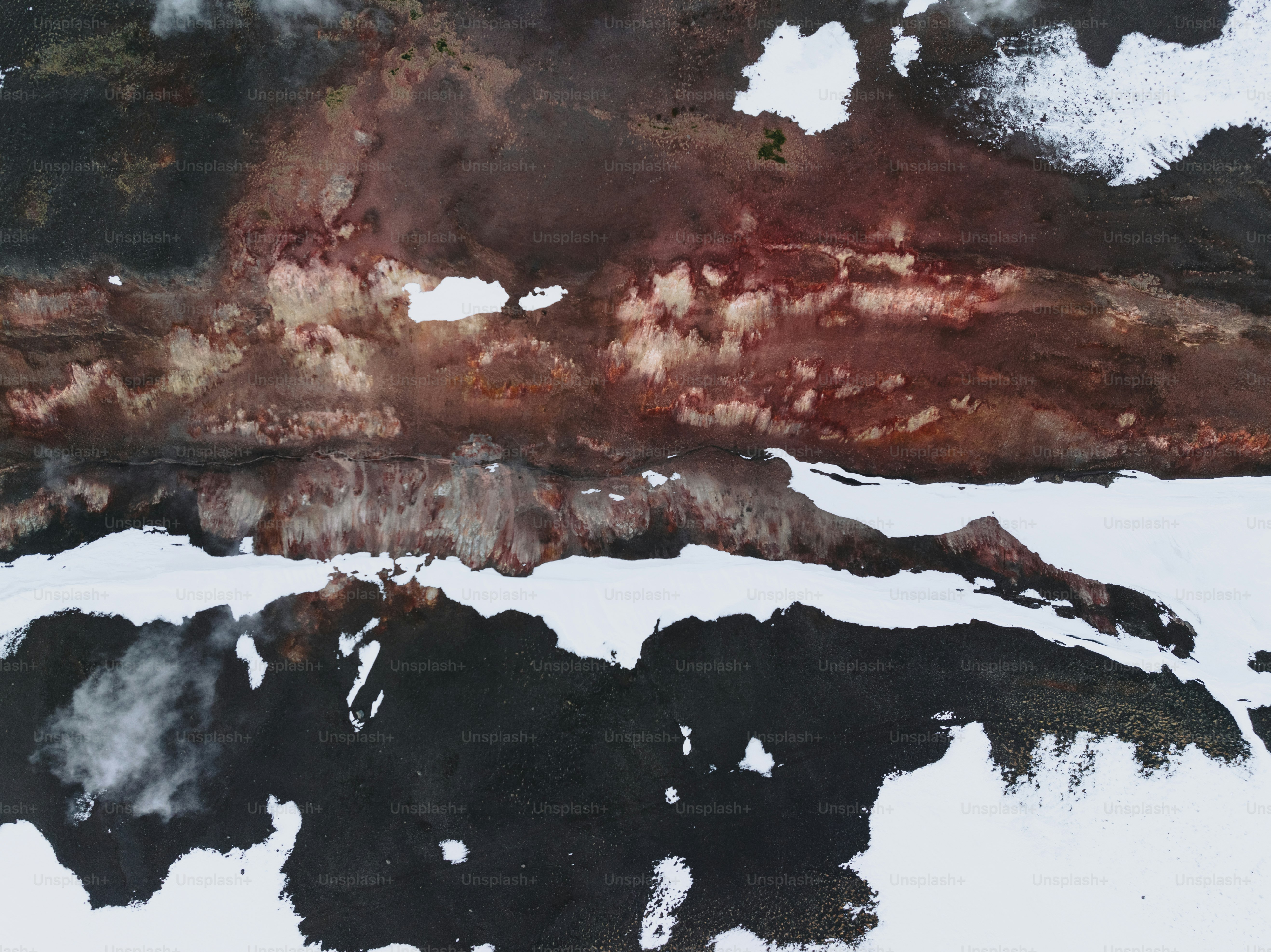 An aerial view of a snow covered mountain photo – Texture Image on Unsplash
