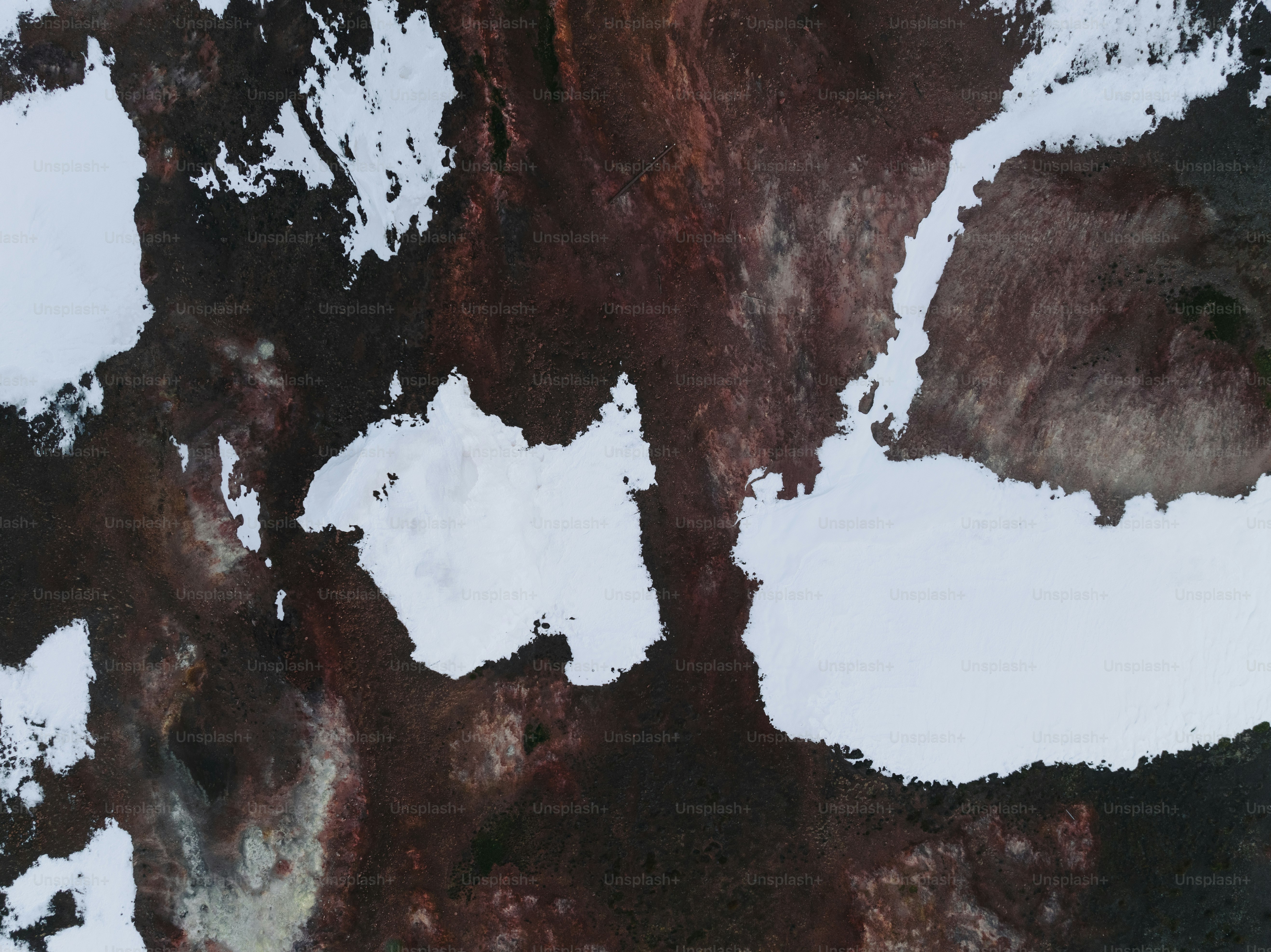 An aerial view of a snow covered mountain photo – Texture Image on Unsplash