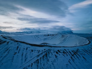 an aerial view of a snow covered mountain range