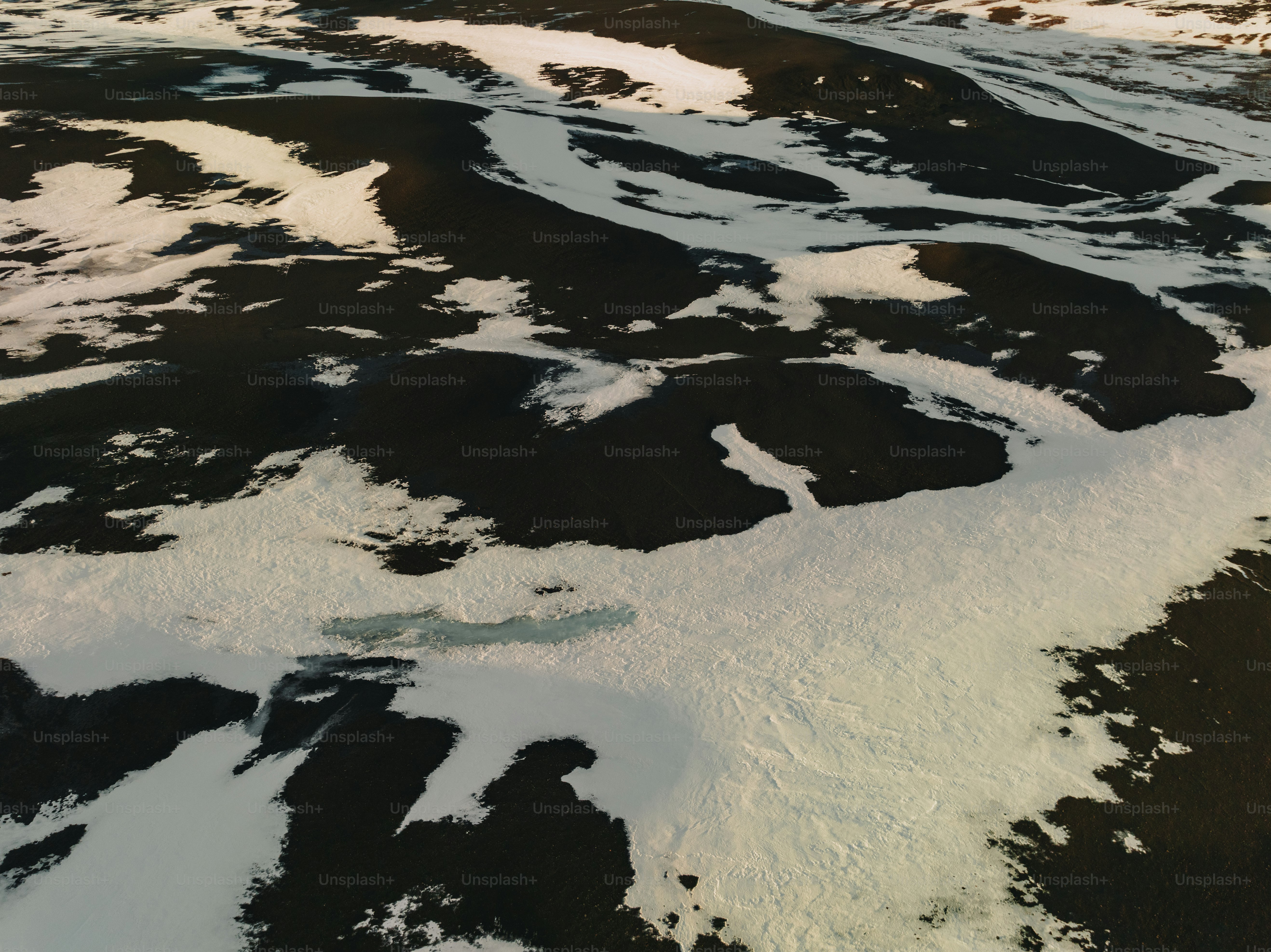 An aerial view of a snow covered field photo – Texture Image on Unsplash