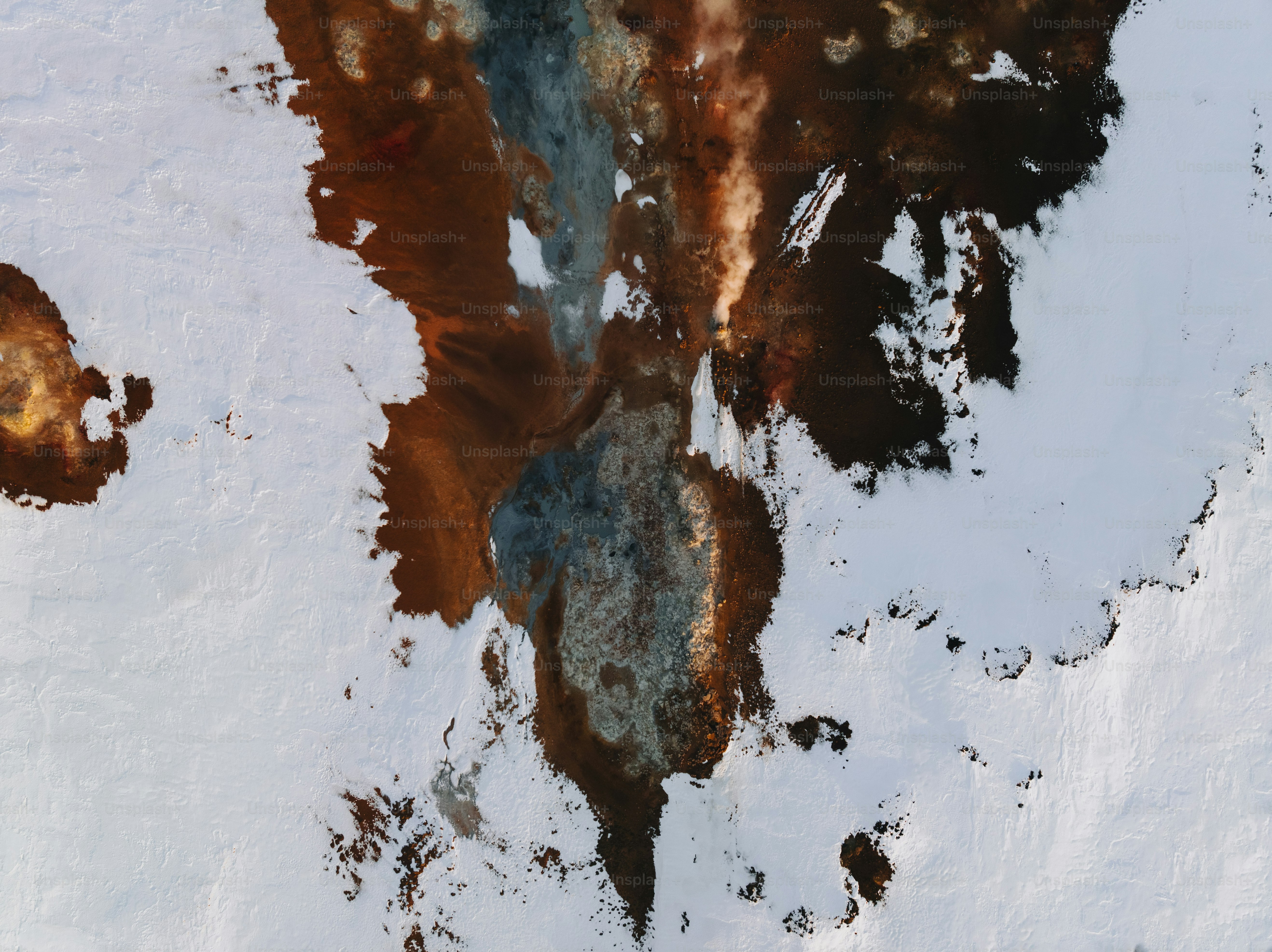 an aerial view of a snow covered mountain