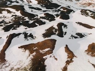 an aerial view of a snow covered mountain