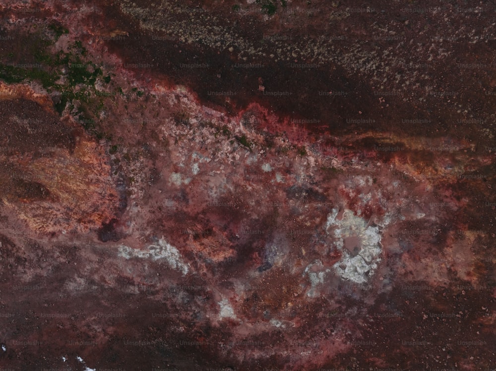 a close up of a red and brown substance