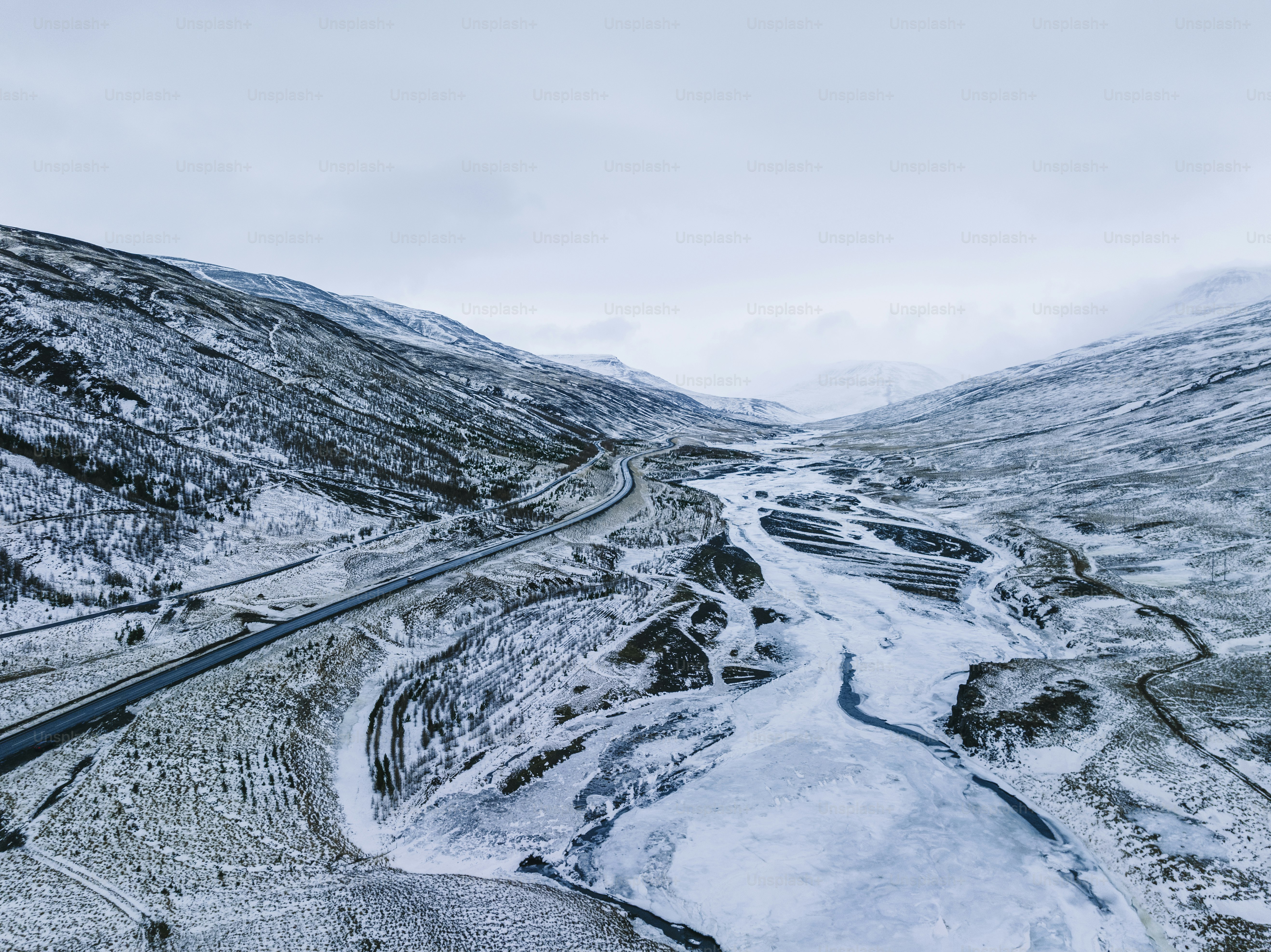 An aerial view of a road in the mountains photo – Road Image on Unsplash