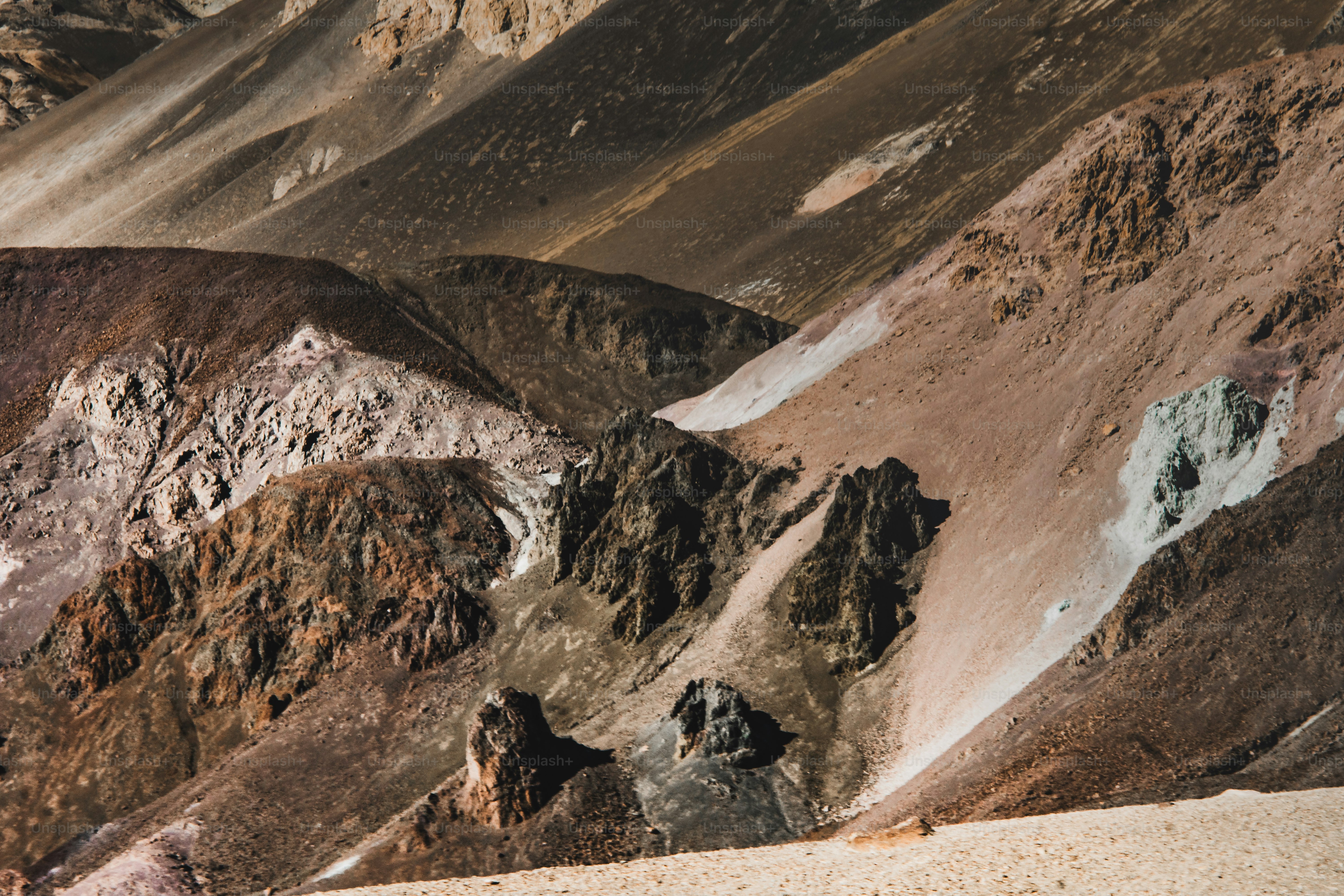 a man riding a snowboard down the side of a mountain