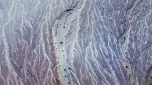 an aerial view of a trail in the sand