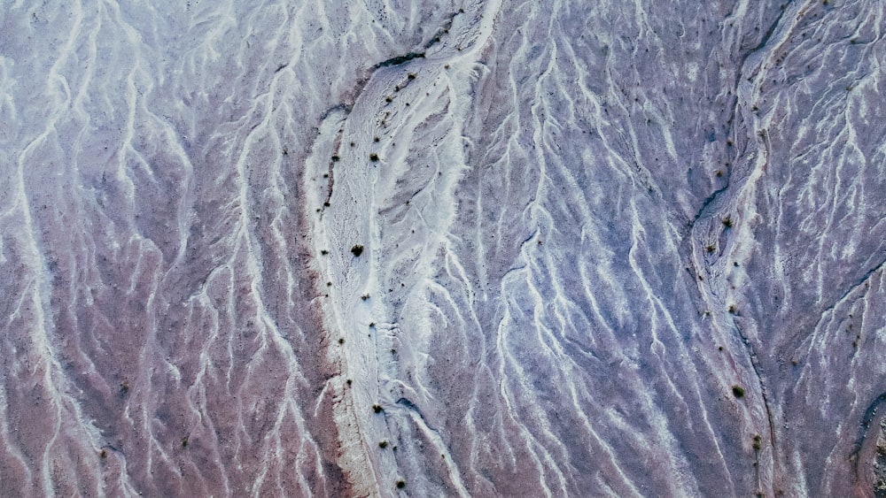 an aerial view of a trail in the sand