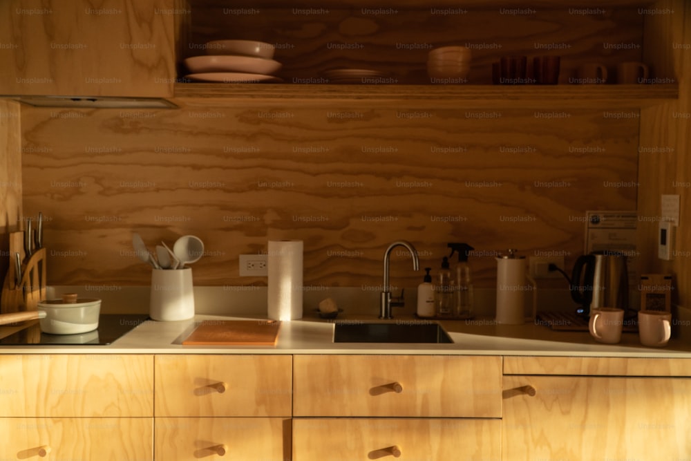 a kitchen with wooden cabinets and counter tops