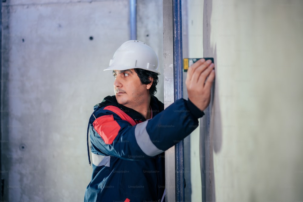 a man wearing a hard hat and safety gear
