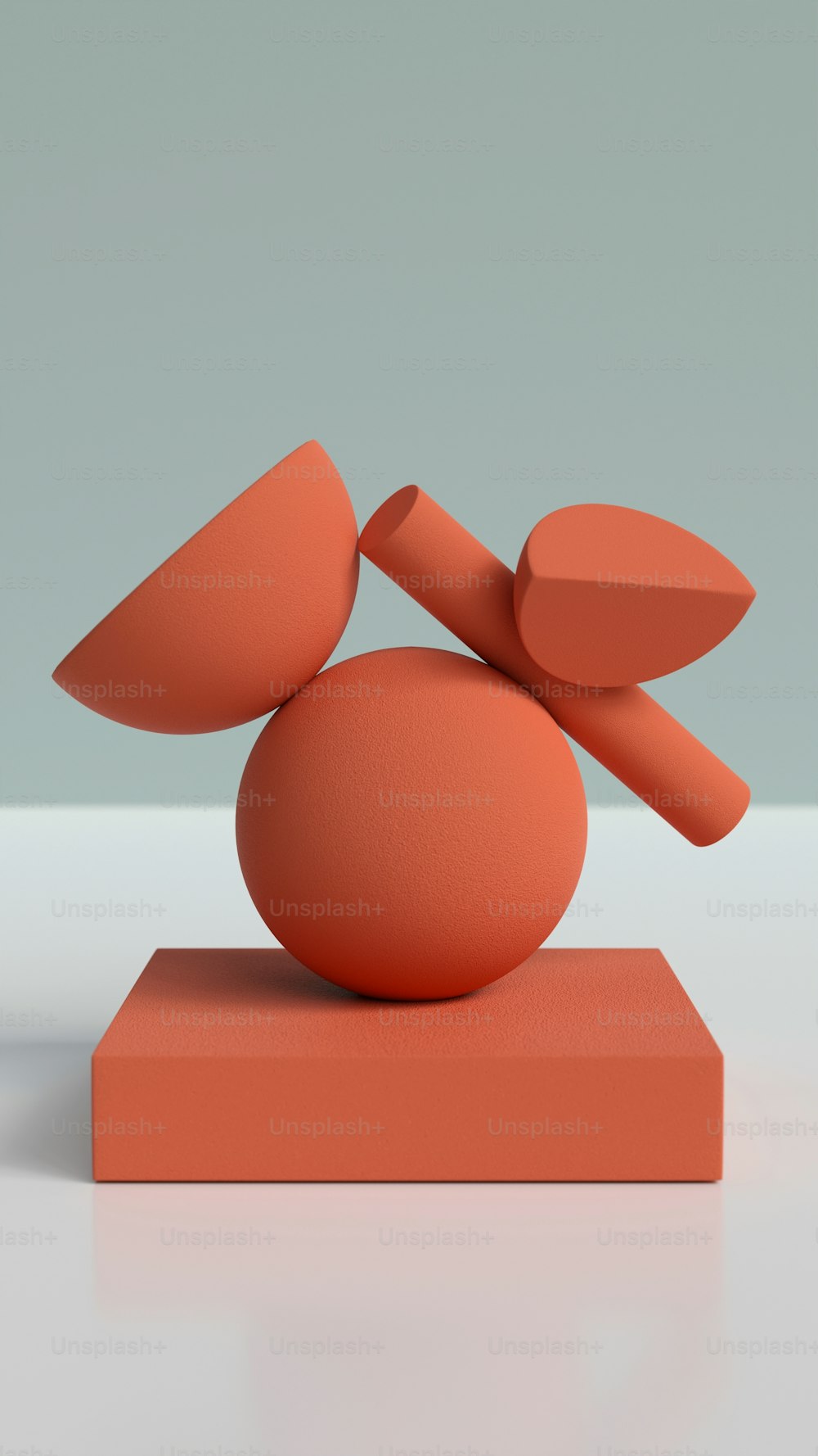 an orange sculpture sitting on top of a table