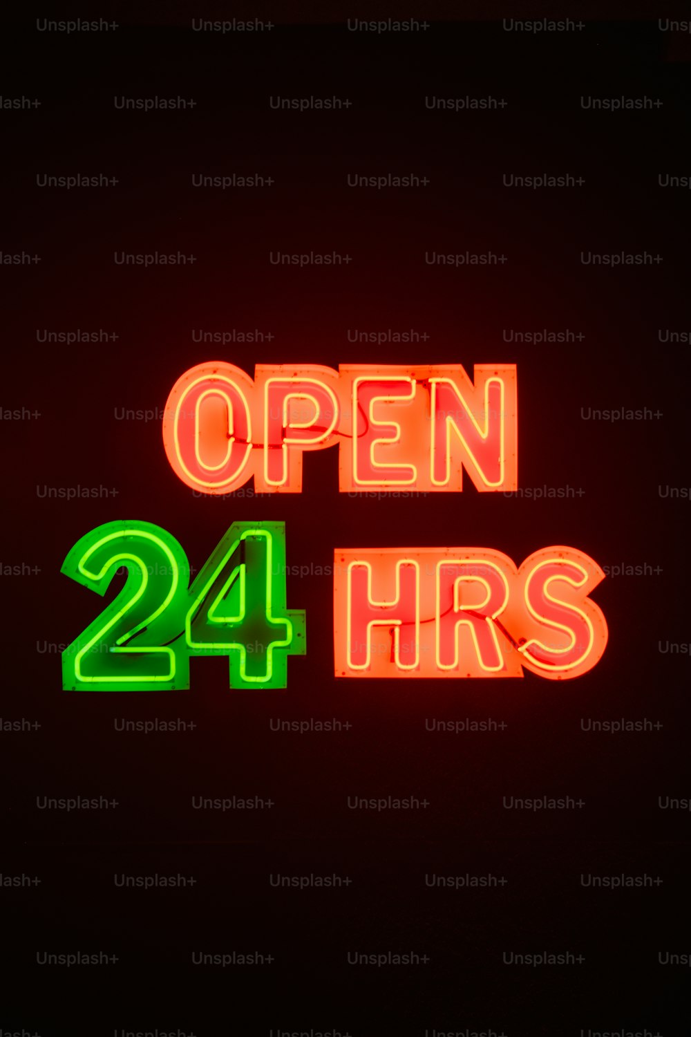 a neon sign that says open 24 hrs