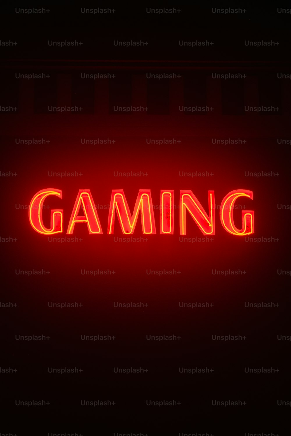 a neon sign that says gaming on it