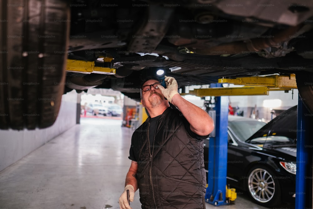 a man working on a car in a garage
