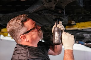a man working on a car under the hood