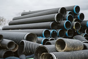 a pile of pipes stacked on top of each other