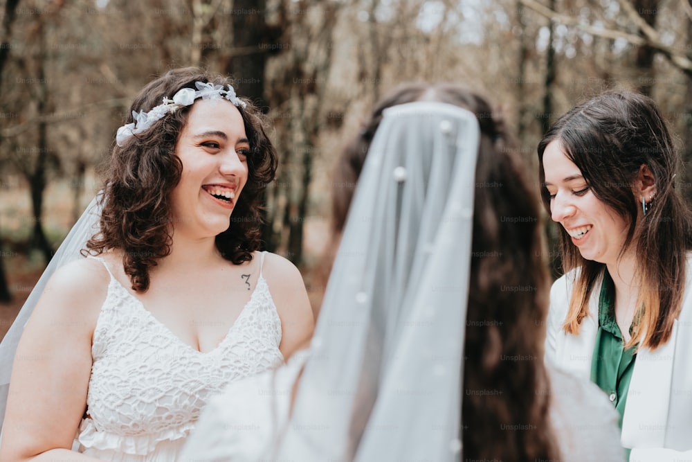 a bride and her bridesmaids laughing together