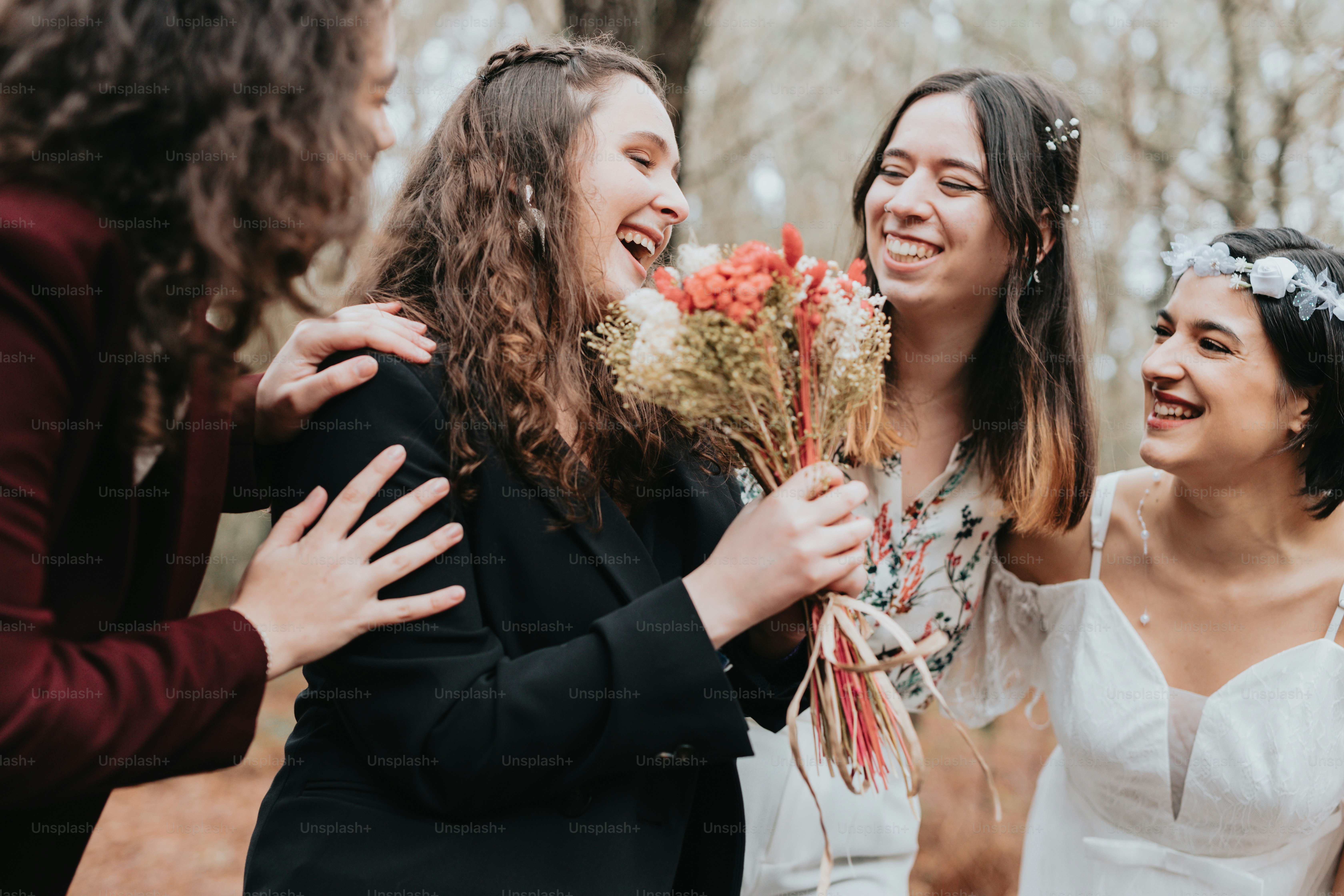 A group of women standing next to each other photo – Wedding Image on ...