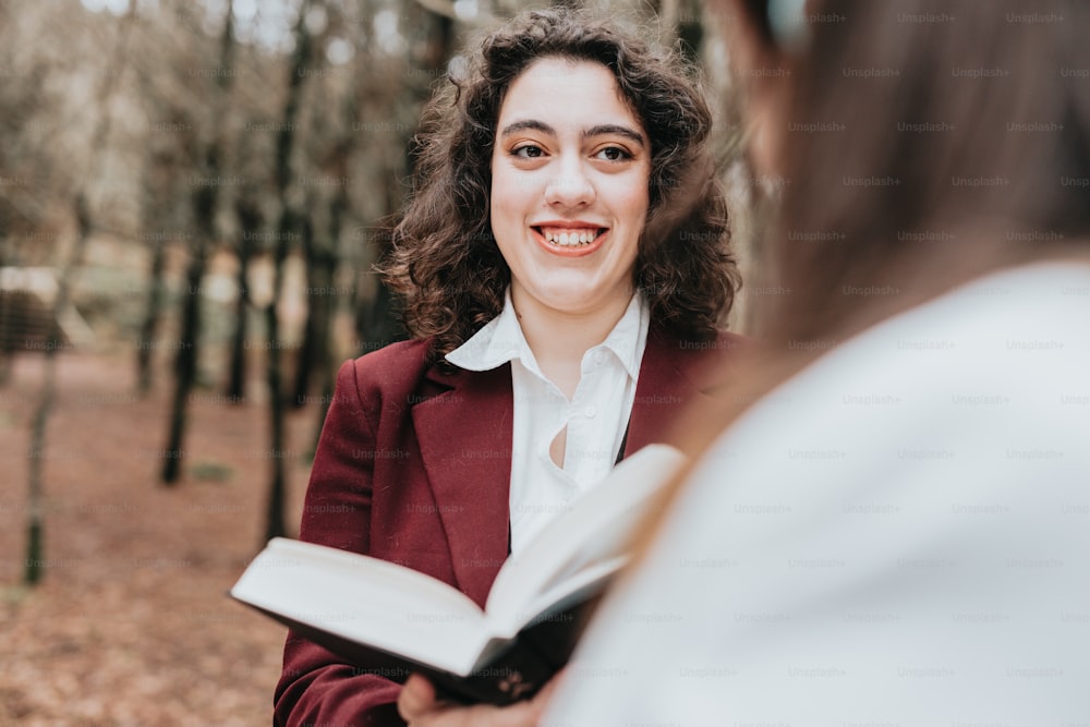 a woman holding a book in her hands