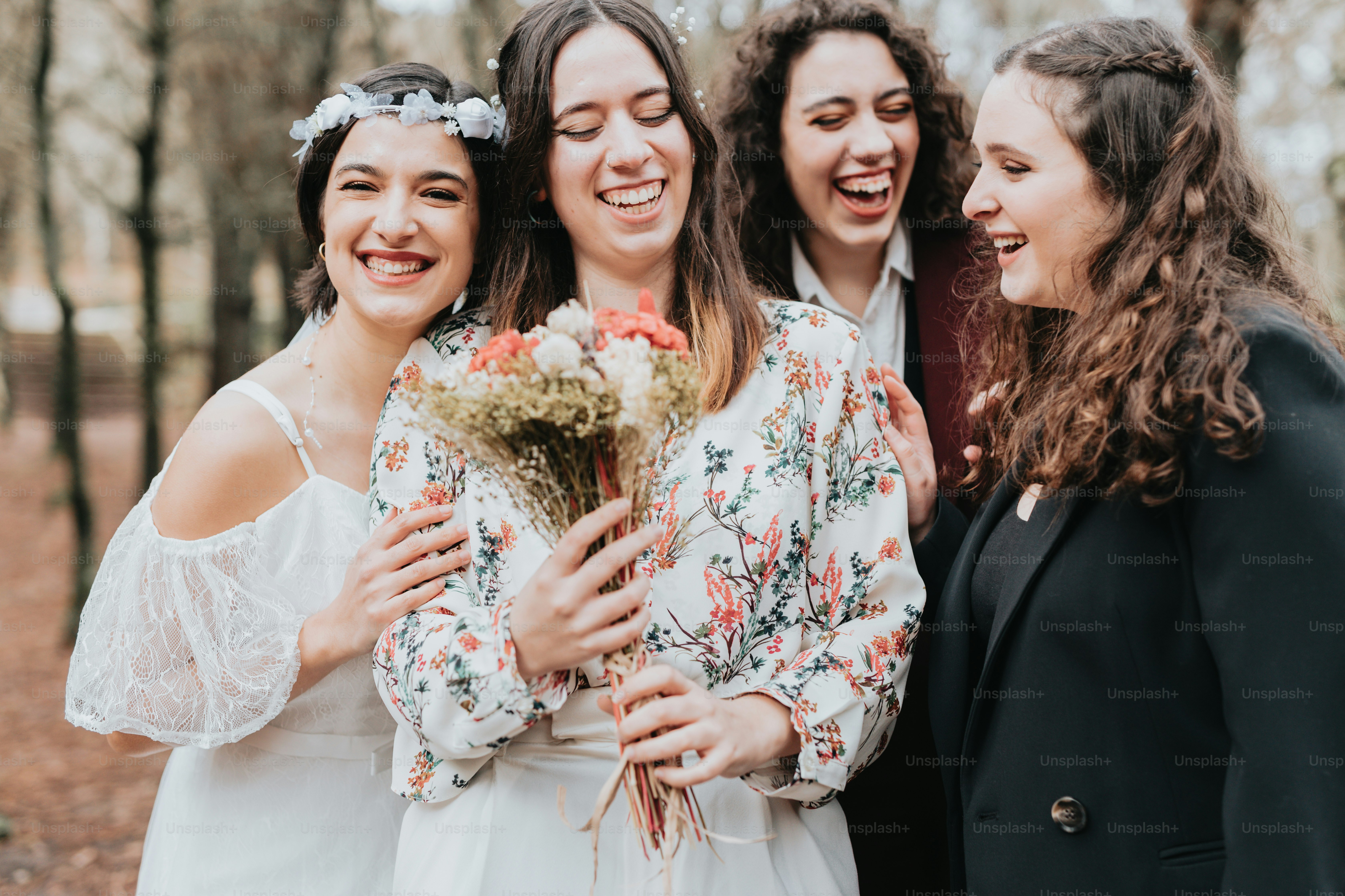 A group of women standing next to each other photo – Wedding couple ...