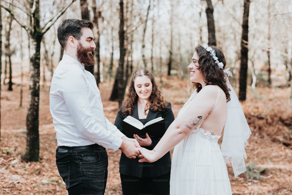 a man and woman holding hands during a wedding ceremony