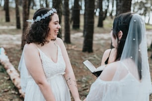 a woman in a wedding dress holding a book