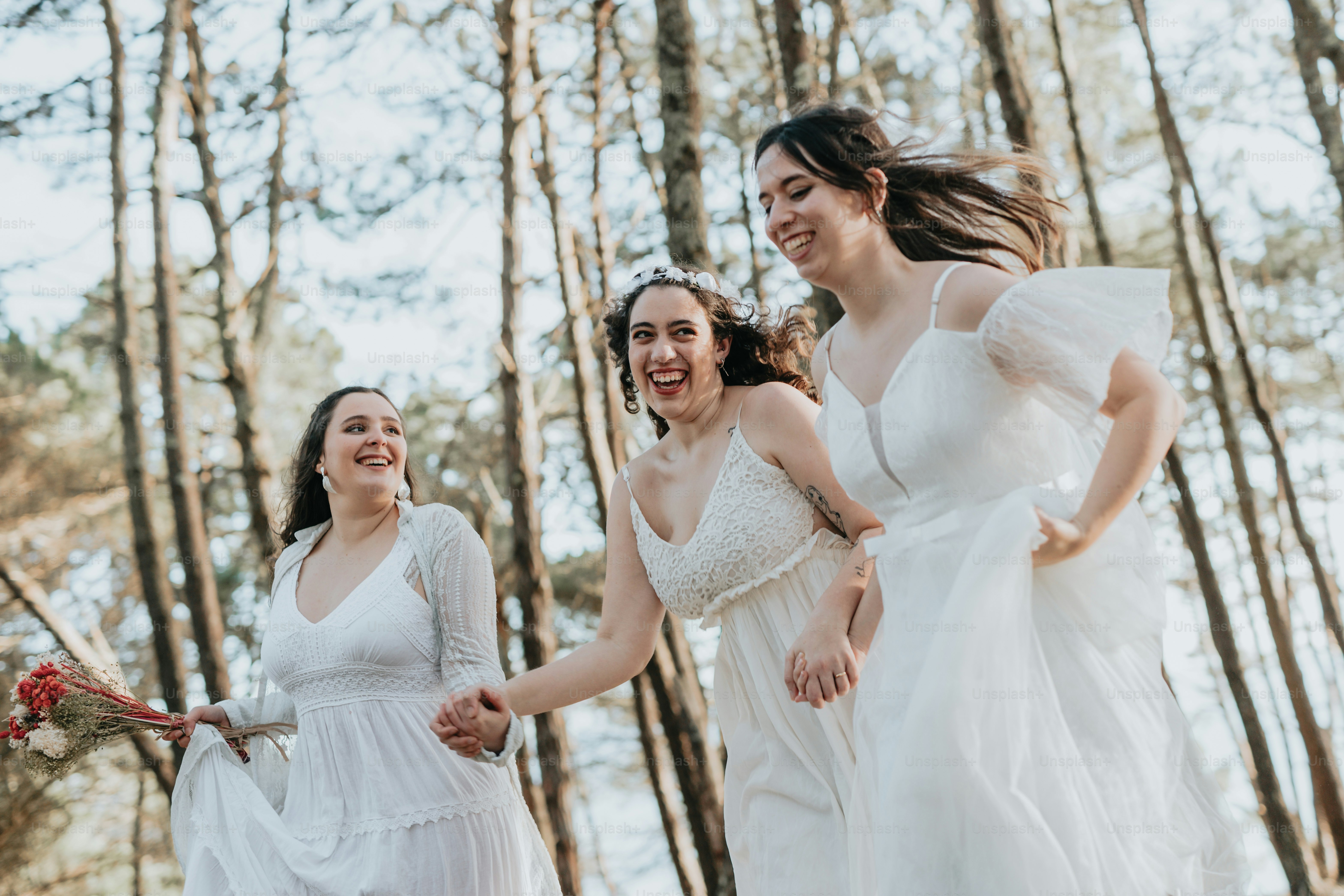 A group of women standing next to each other photo – Wedding Image on ...