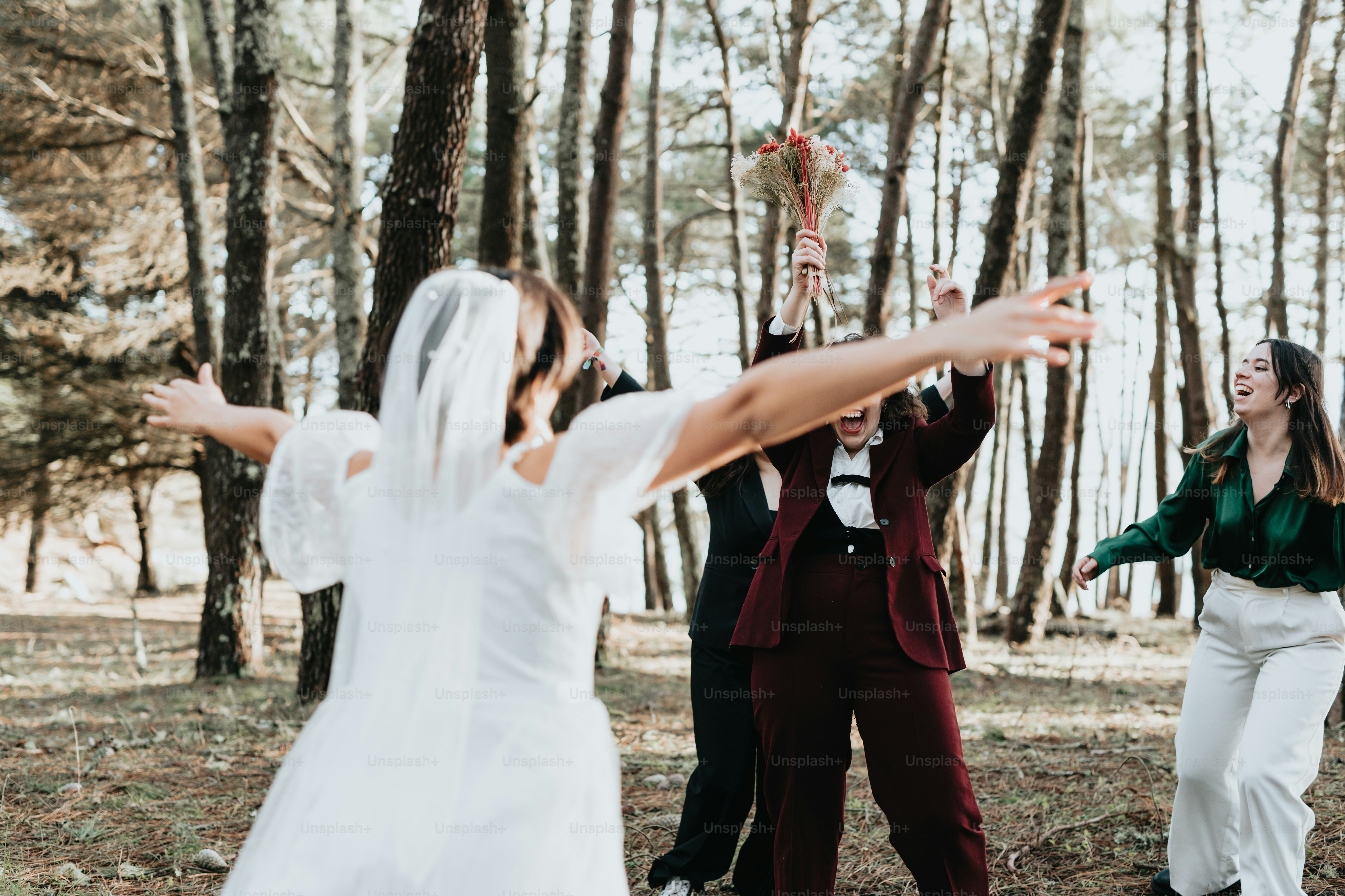 a couple of people that are standing in the woods
