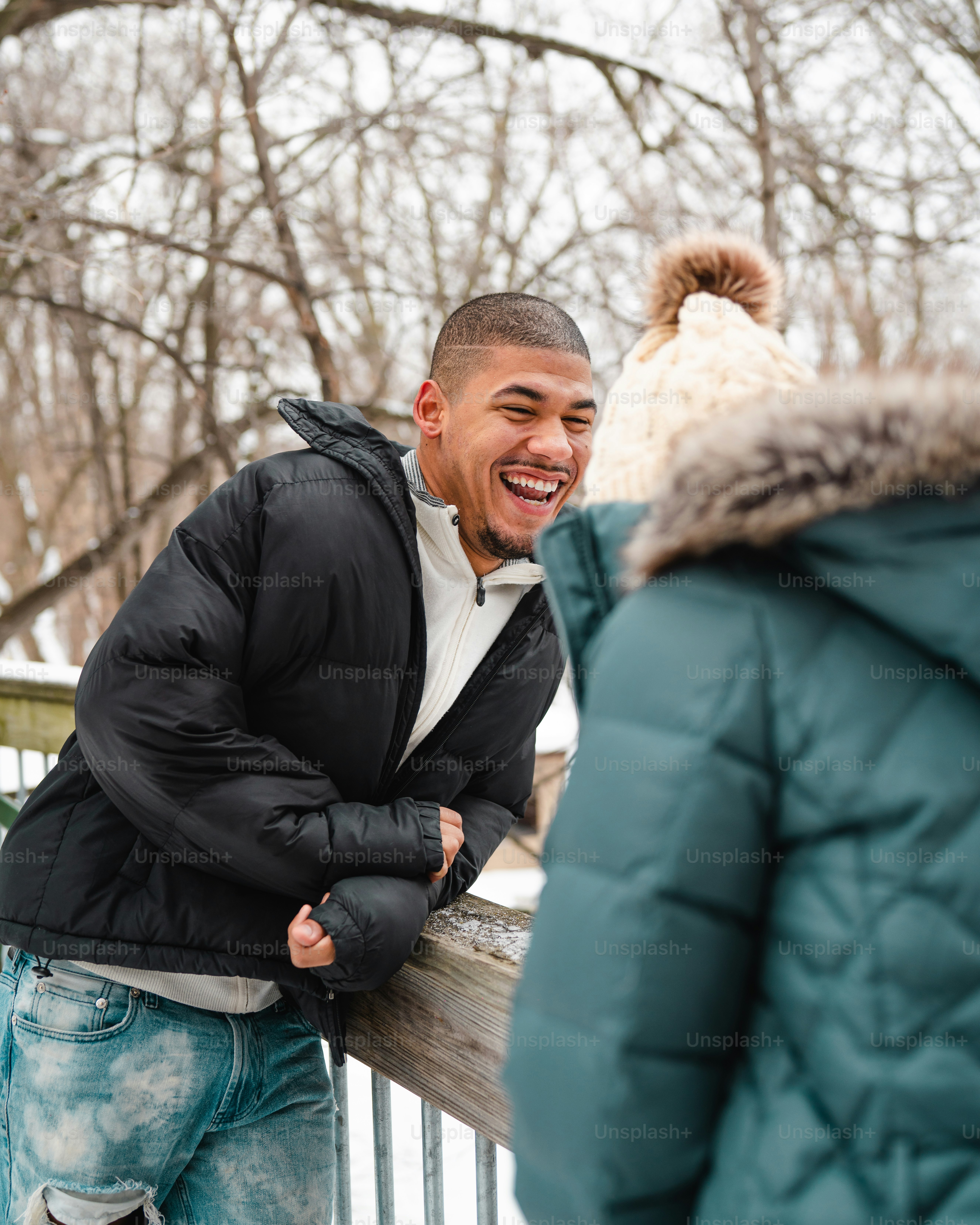 a man in a black jacket and a woman in a blue jacket