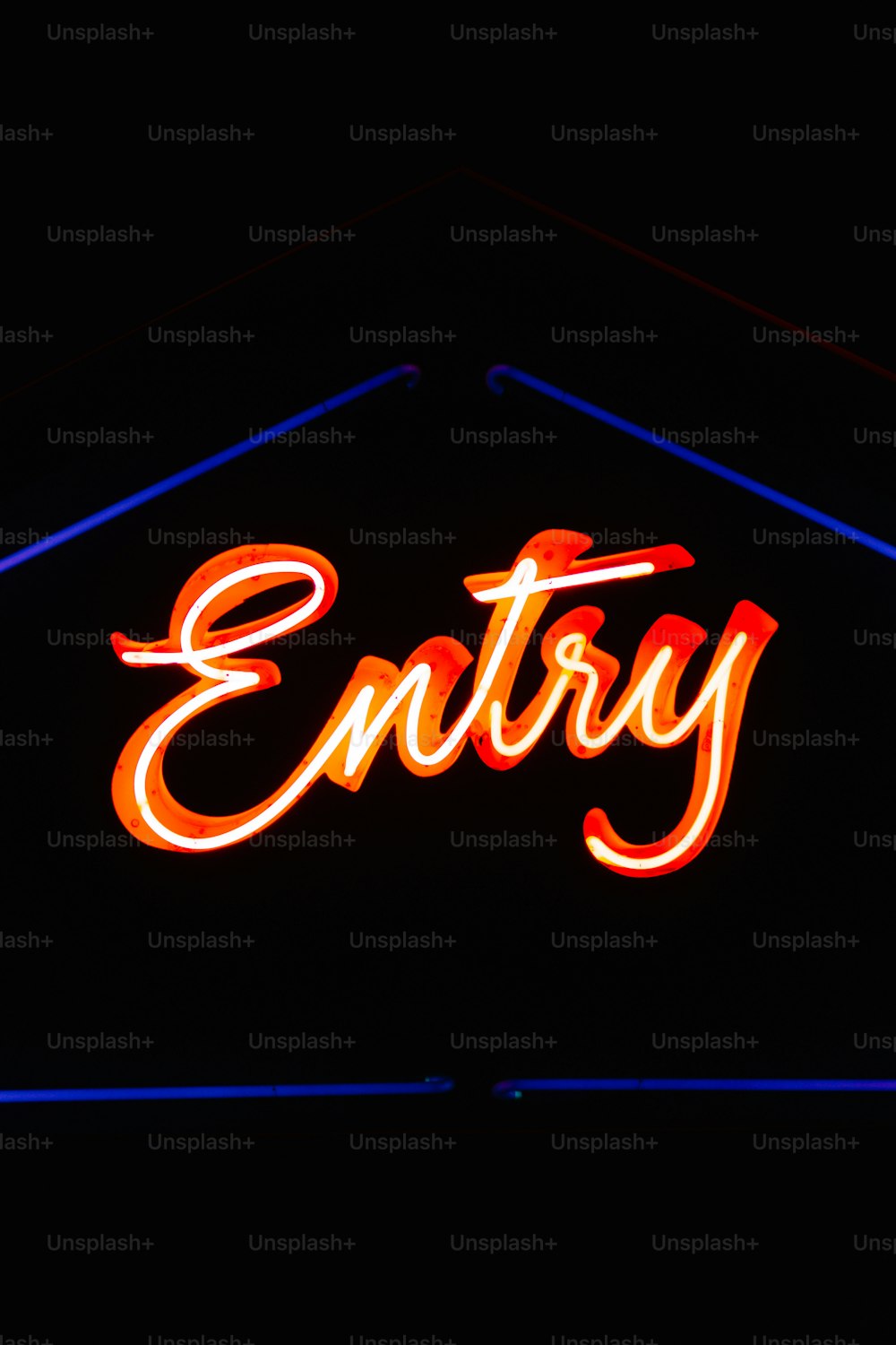 a neon sign that says entry on it