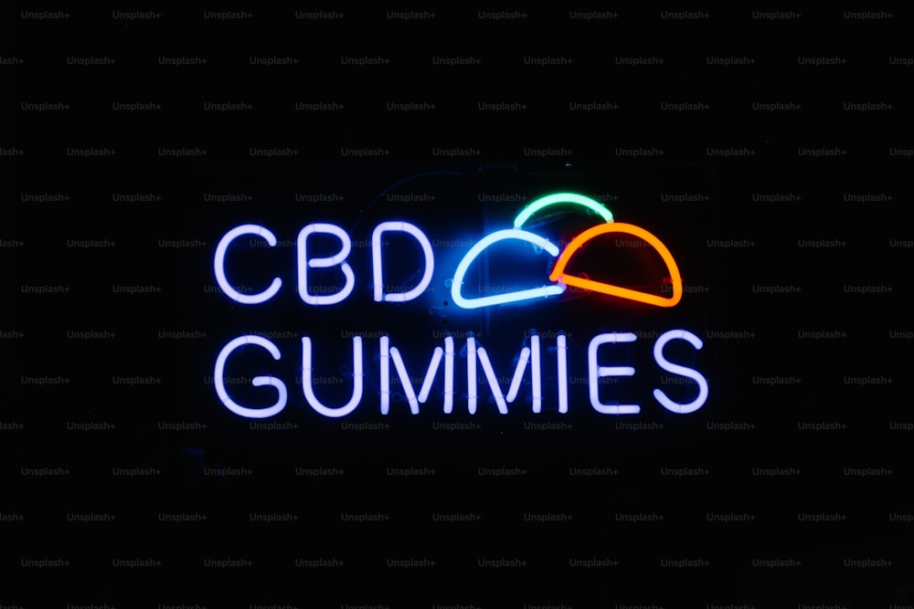 a neon sign that says cbd gummies