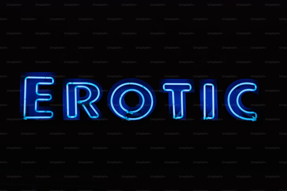 a blue neon sign that says erotic on a black background