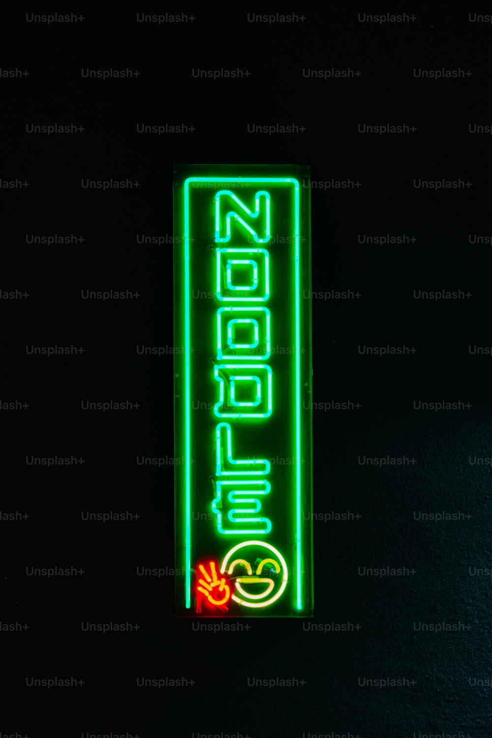 a neon sign that is on the side of a wall