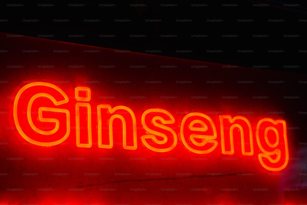 um sinal de néon vermelho que lê ginseng