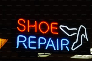 a neon sign that says shoe repair