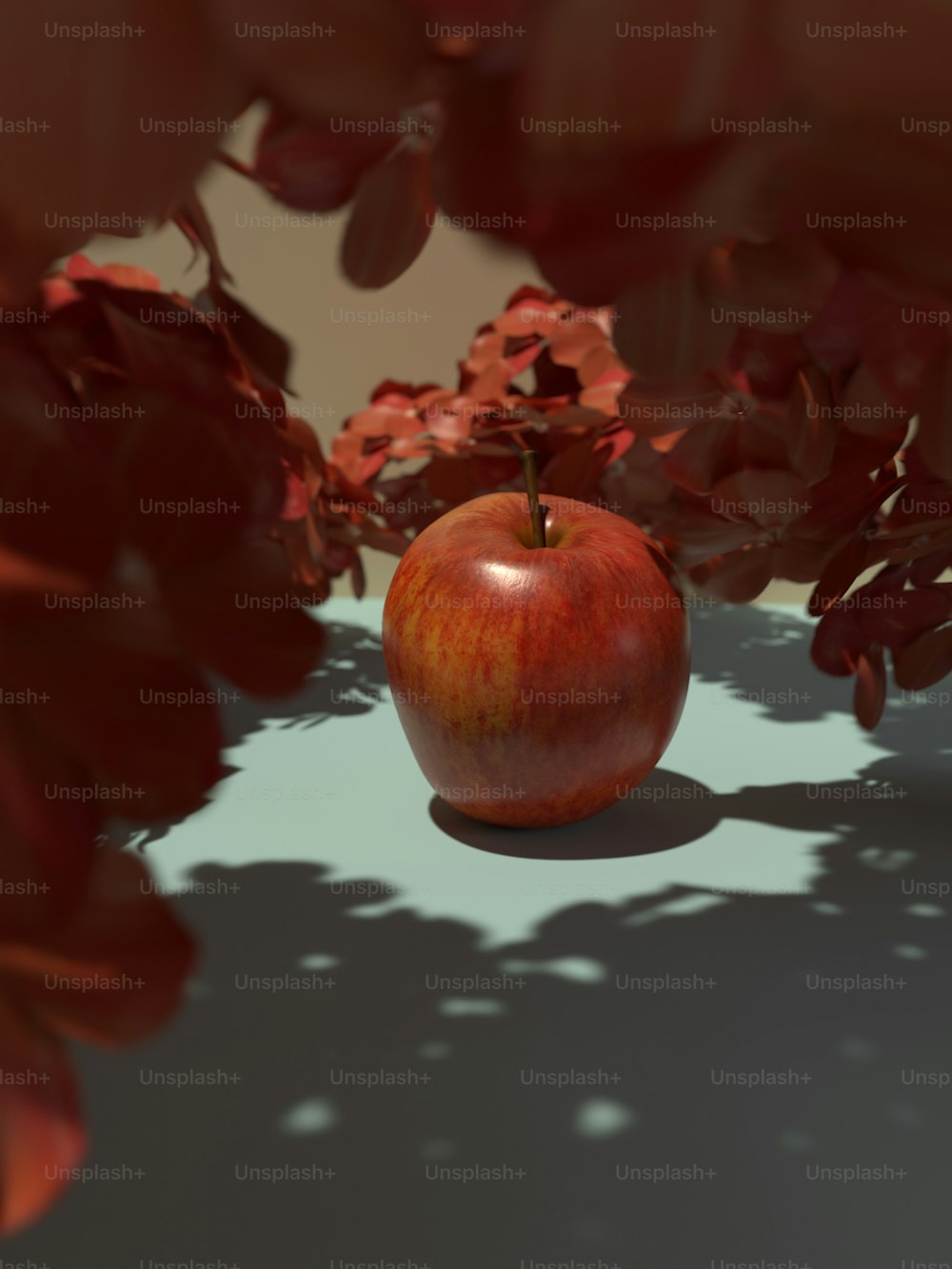 uma maçã vermelha sentada em cima de uma mesa
