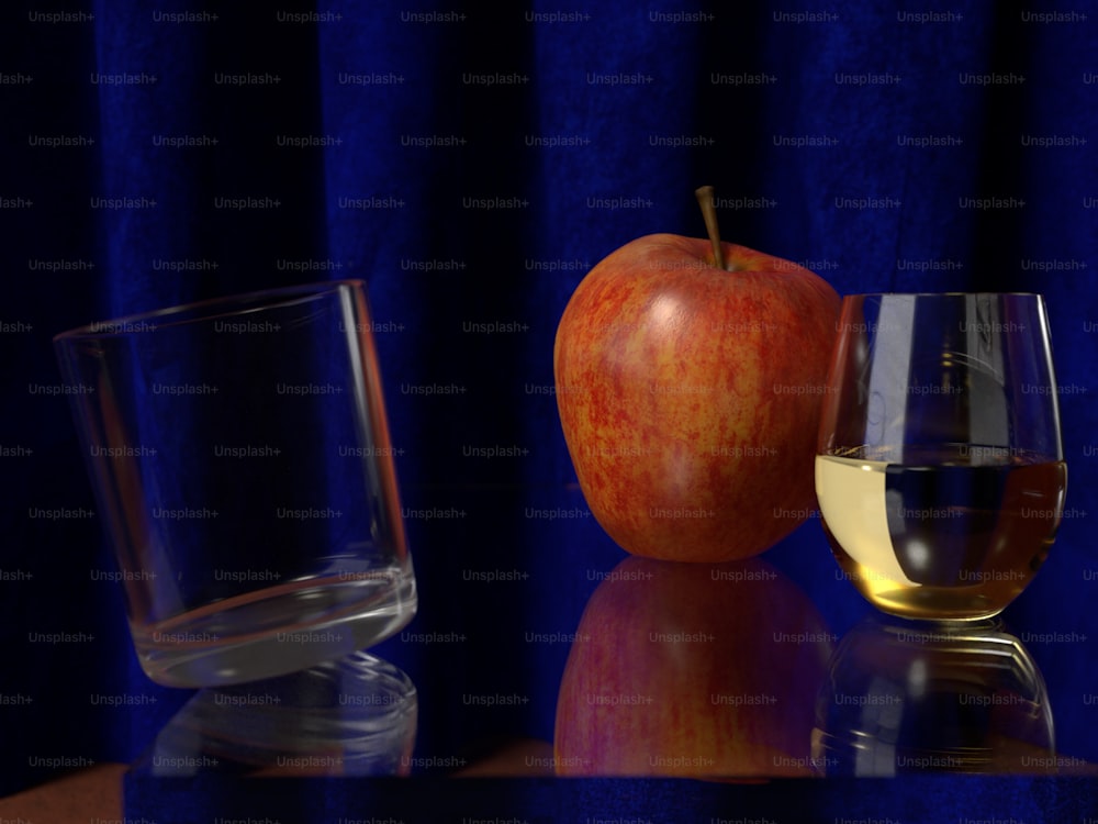テーブルの上のワインとリンゴのグラス