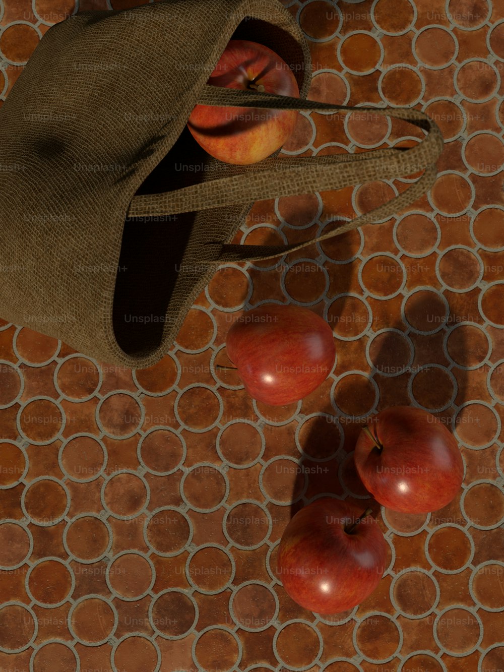 un sombrero y algunas manzanas en un piso de baldosas