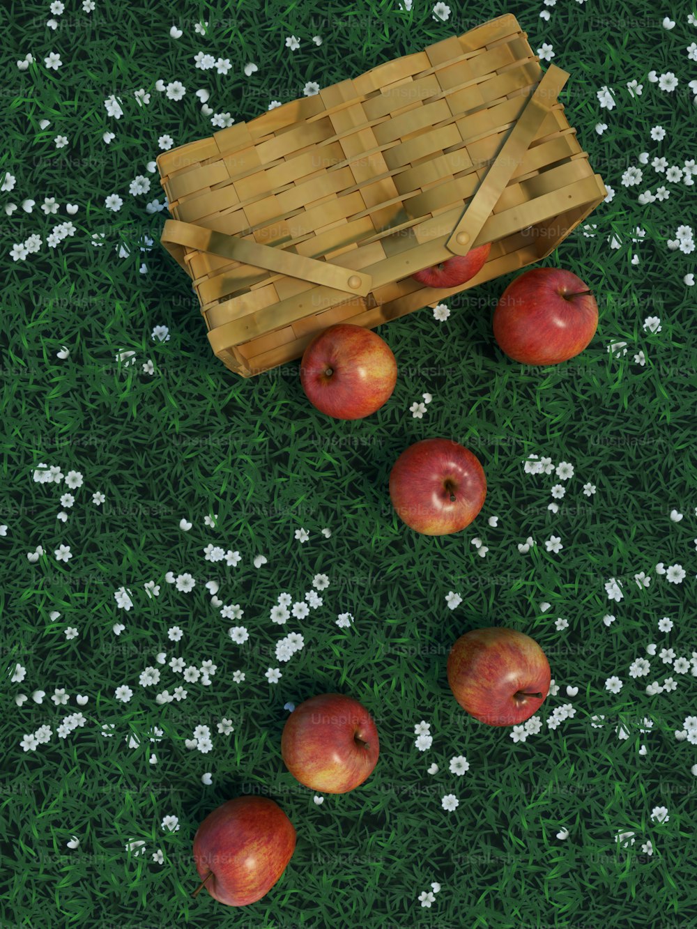 Una canasta de manzanas en una hierba verde
