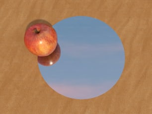 two apples sitting on top of a wooden table