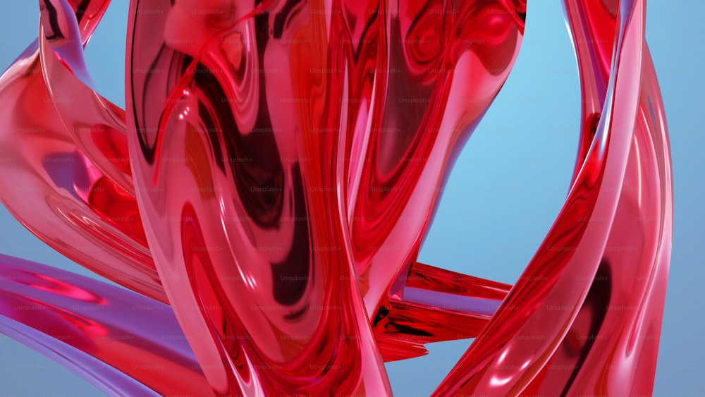 um close up de um objeto vermelho em um fundo azul