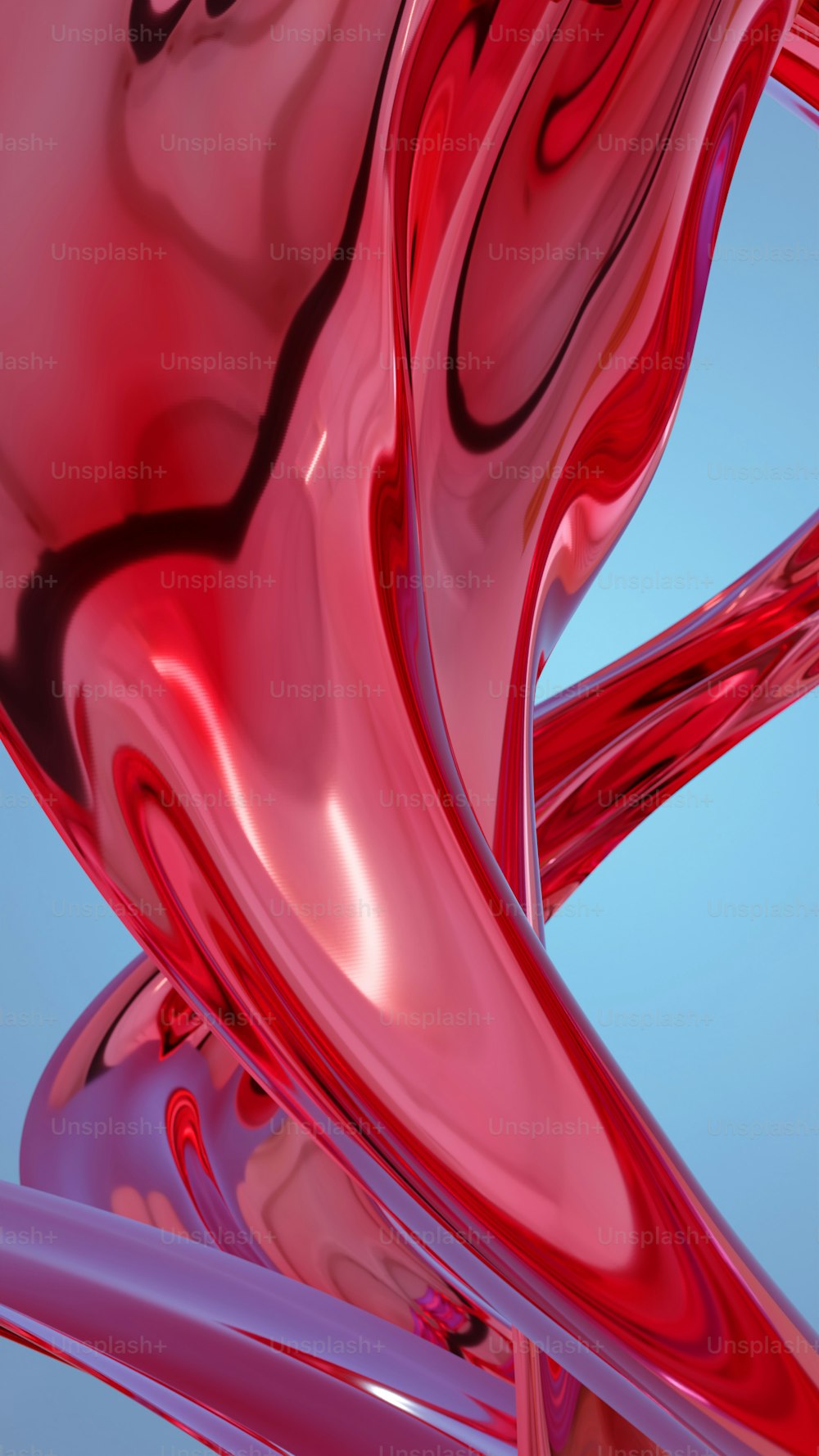 um close up de um objeto vermelho com um fundo azul