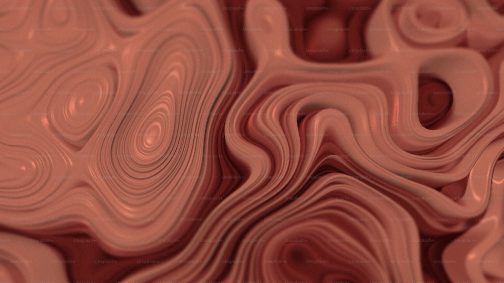 a close up view of a red and pink surface