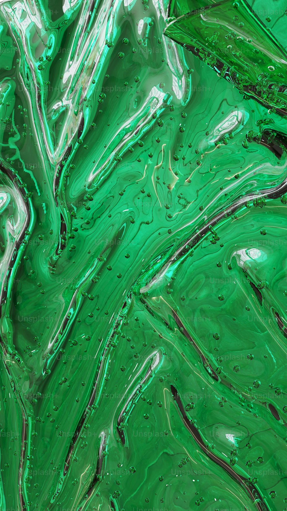 un primo piano di una texture liquida verde