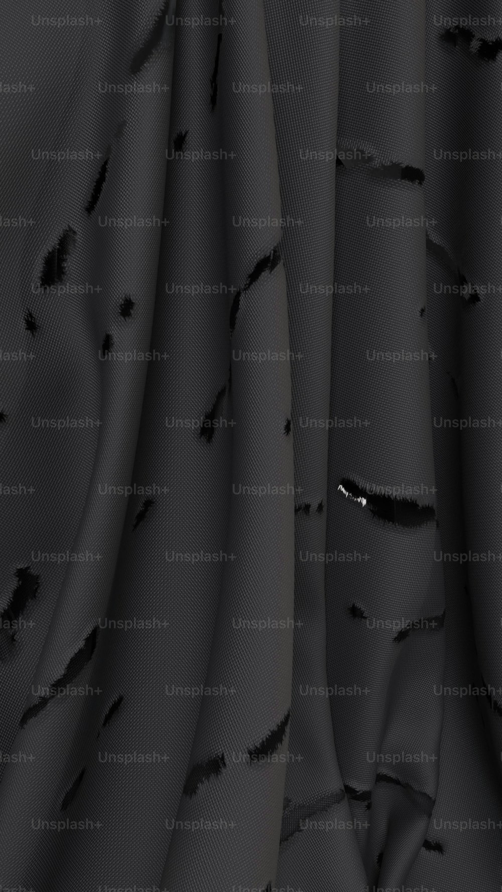 un gros plan d’un tissu noir avec un motif